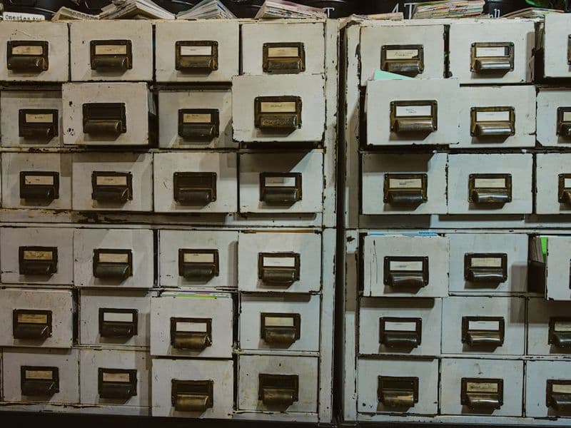 Rows of old filing cabinets with labels