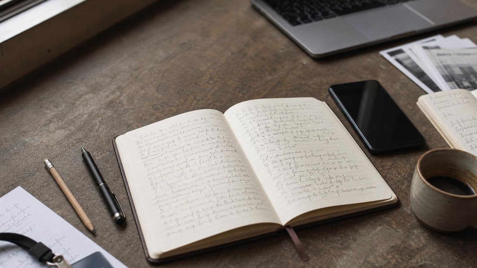 Editorial desk scene with a reporter's notebook, scattered notes, and writing tools for the Typeahead journalists post hero